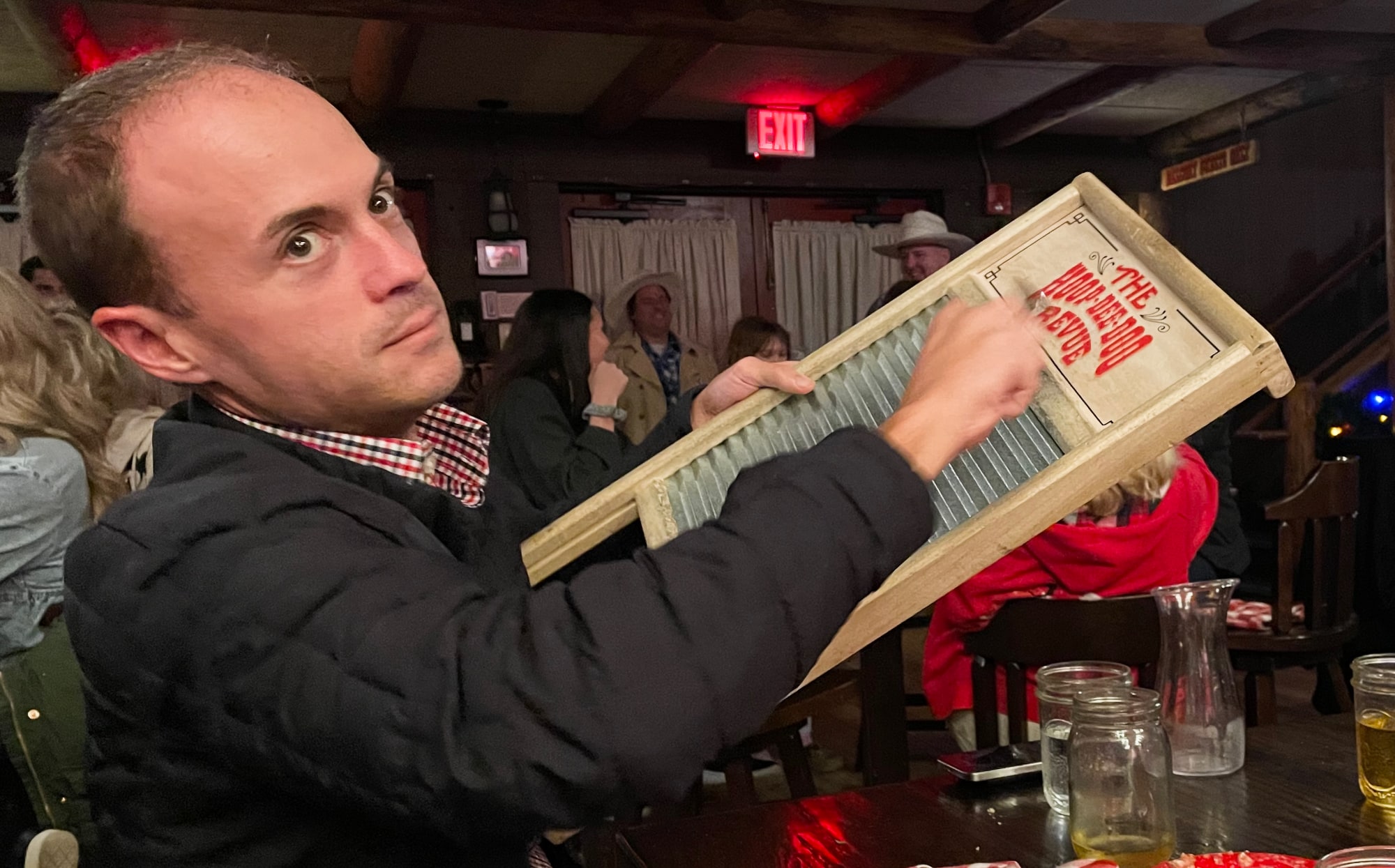 Justin playing the washboard with a spoon
